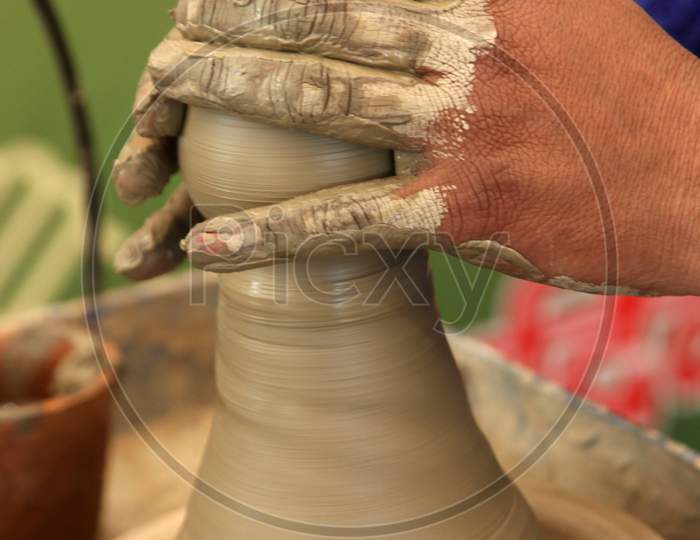 Close up shot of a Person making a Pot