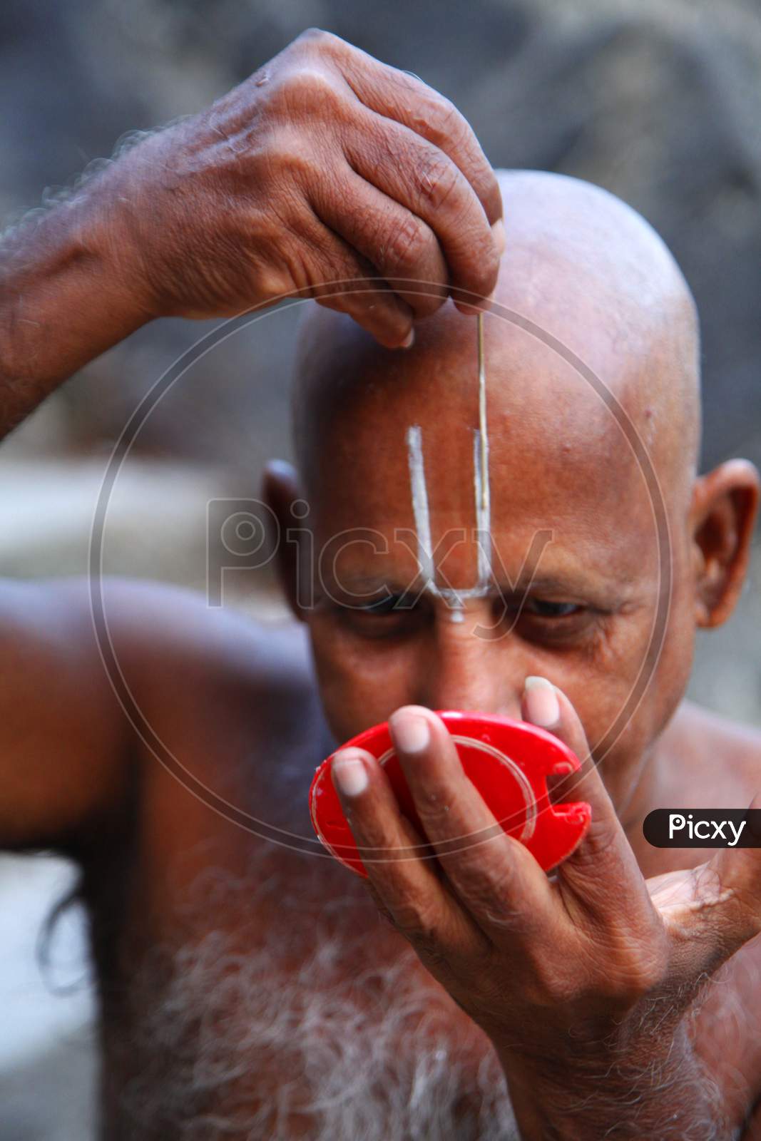 Portrait of a Middle-Aged Indian Man keeping Namam