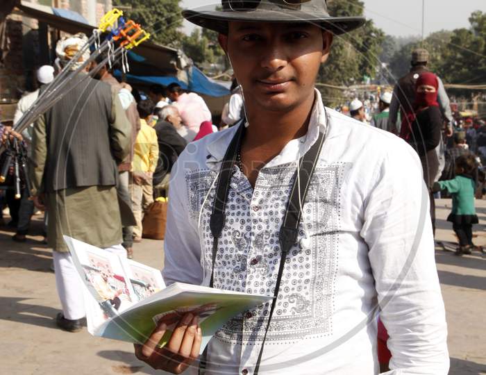 A Young Indian Boy with Camera