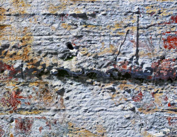 Detailed close up view on very old and weathered brick walls with cracks found in London