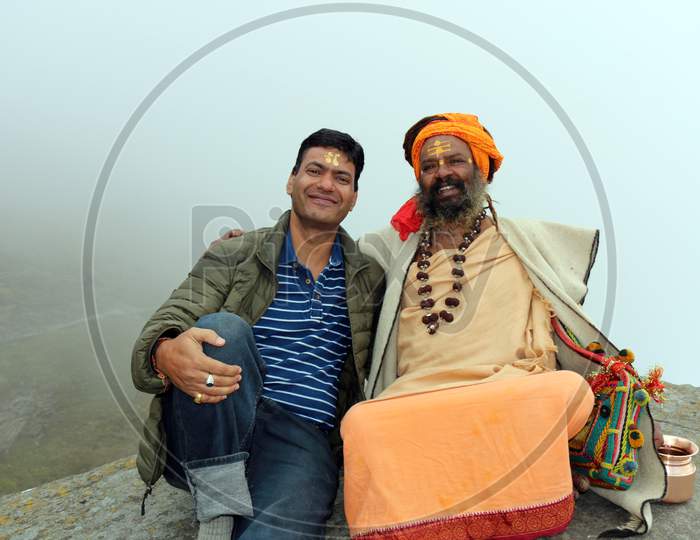 Portrait of an Old Indian Hindu Sadhu or Baba with a devotee