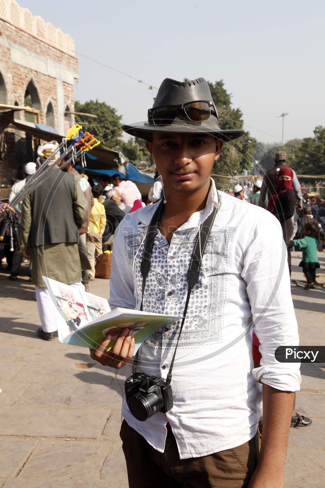 A Young Indian Boy with Camera