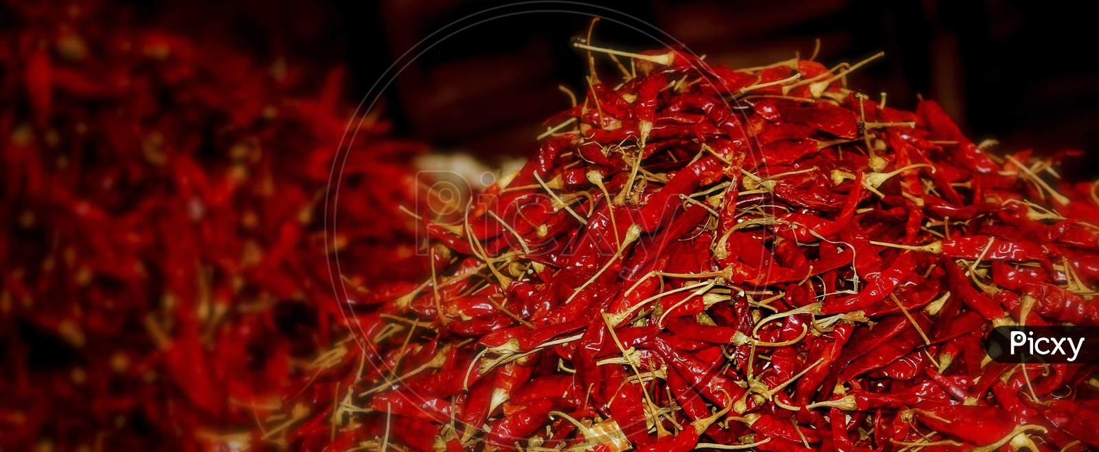 Close Up Of Red Dried Chili Flakes Food Background