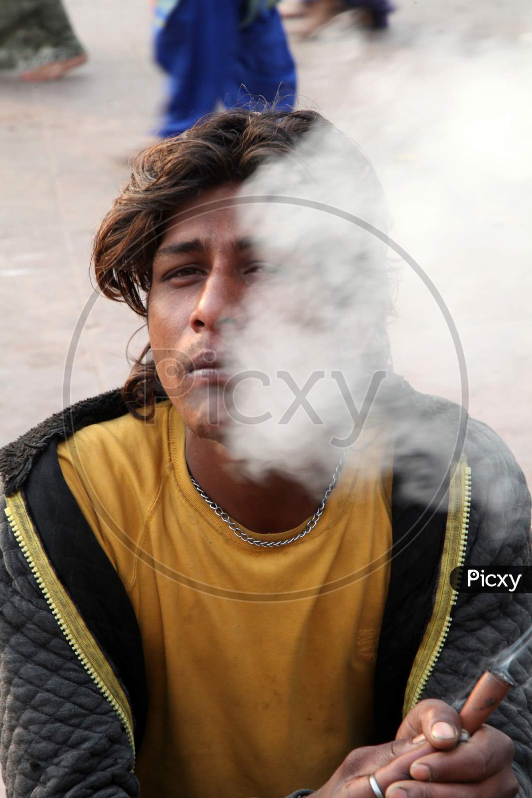 Portrait of a Young Indian Man smoking