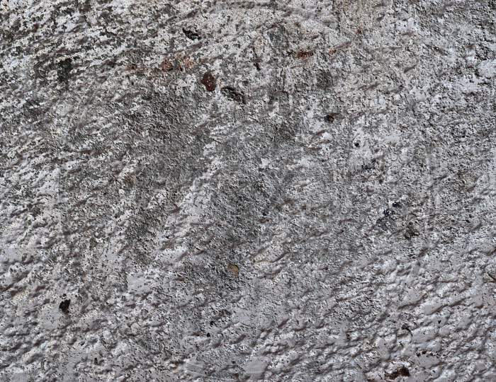 Close up detailed surface of granite and concrete mixed walls in high resolution