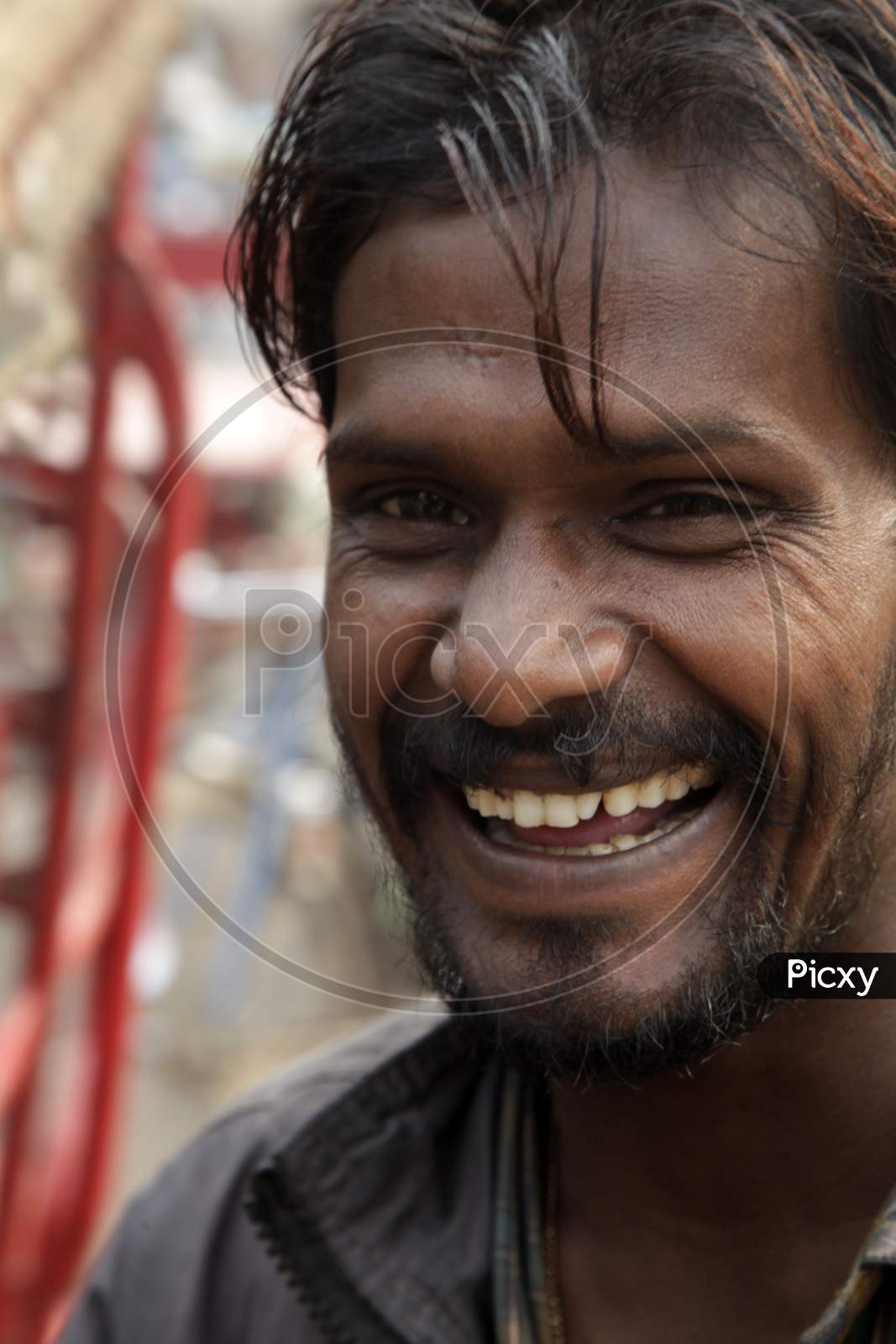Portrait of a Young Indian Man with Smiling Face