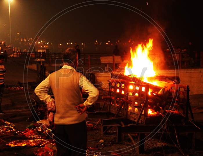 People near a Fire in Varanasi