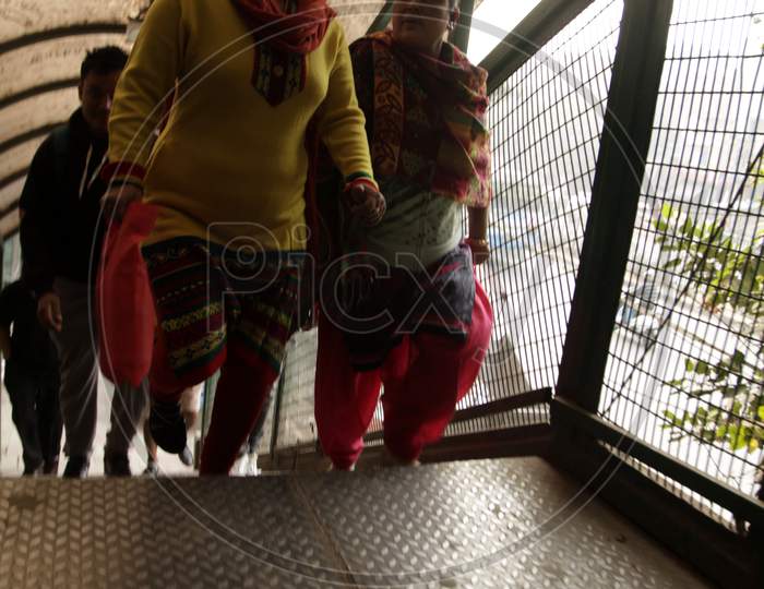 People walking on the Foot-over Bridge