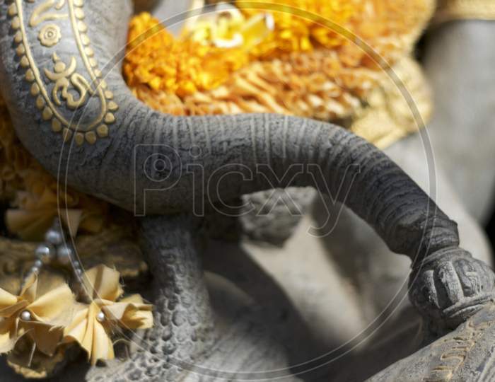 Close Up Picture Of A Ganesha Statue'S Trunk