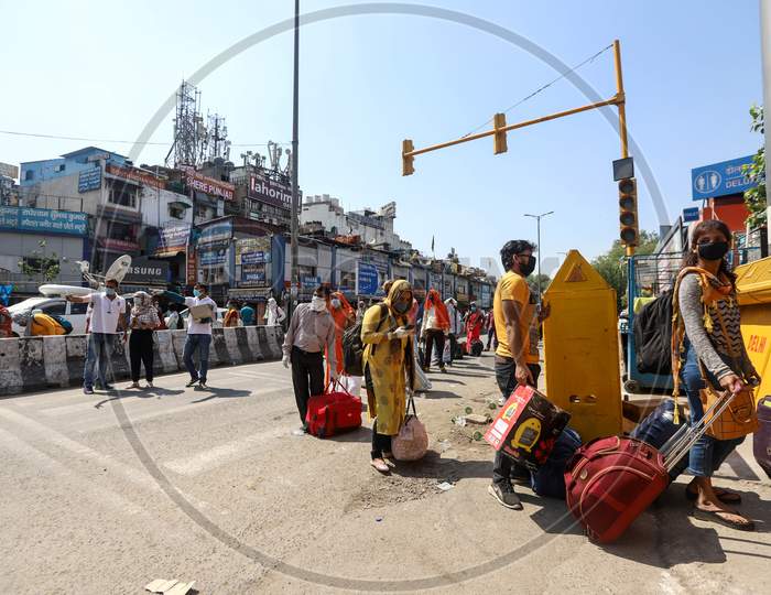 People Wait In A Queue Outside The Railway Station To Board The Train For Home, After The Government Eased Lockdown, At New Delhi Railway Station, On May 12, 2020 In New Delhi, India.