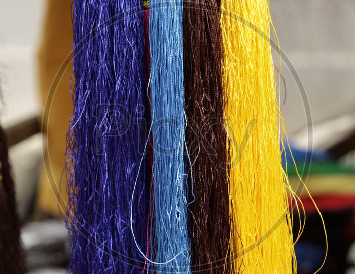 Selective focus on Coloured Cloth threads