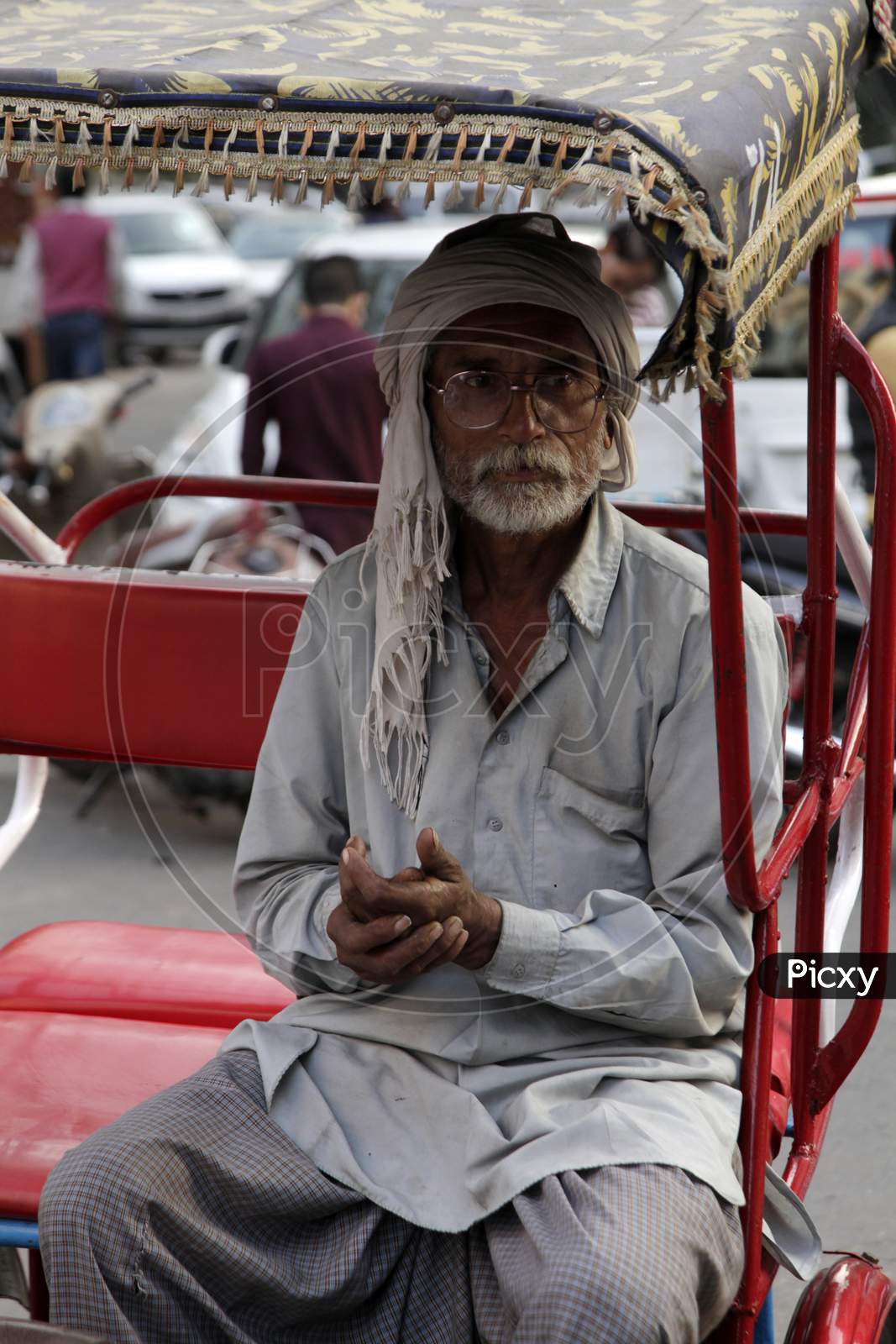 An Old man in Rickshaw