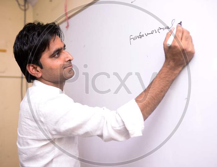Concept of a Faculty Writing on White Board