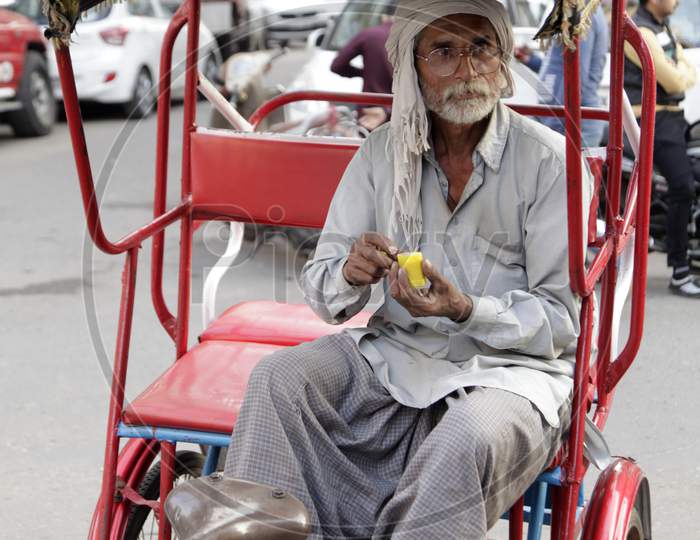 An Old man in Rickshaw