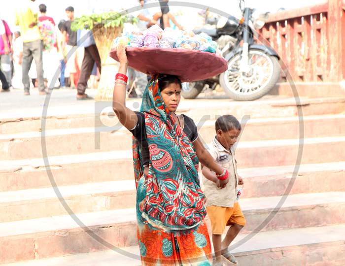 A Bangle Vendor with her Child