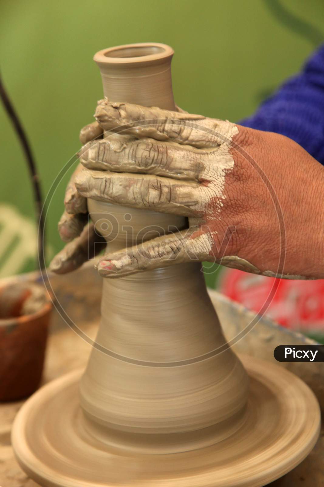 Close up shot of a Person making a Pot