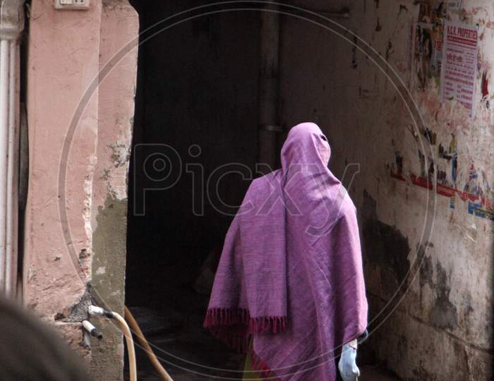 A Women walking with a Shawl