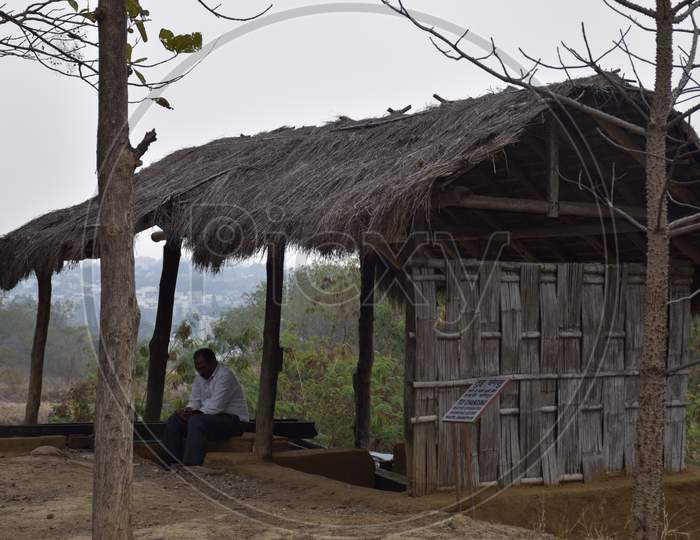 Bhopal, Madhya Pradesh/India : January 15, 2020 - A Man Sitting In A Tribal Hut At Manav Sangrahalaya Bhopal