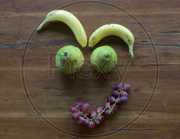 A Funny Face Made Out Of Various Fruits