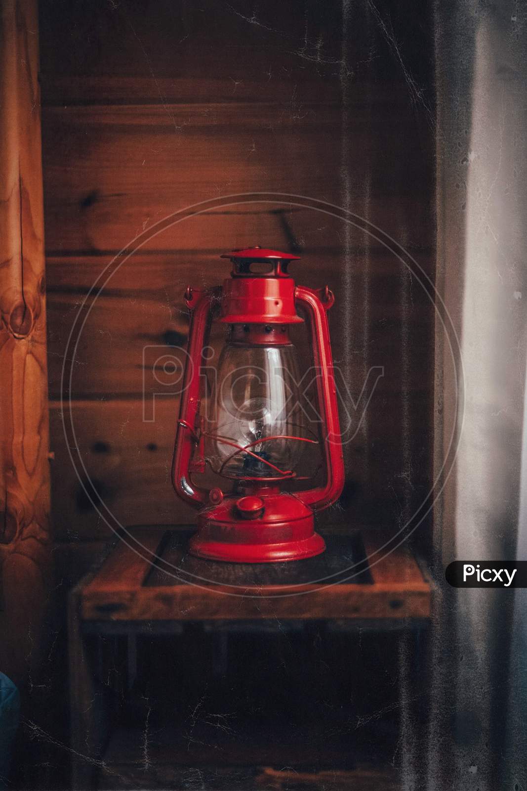 Old fashioned red colored lantern / oil lamp