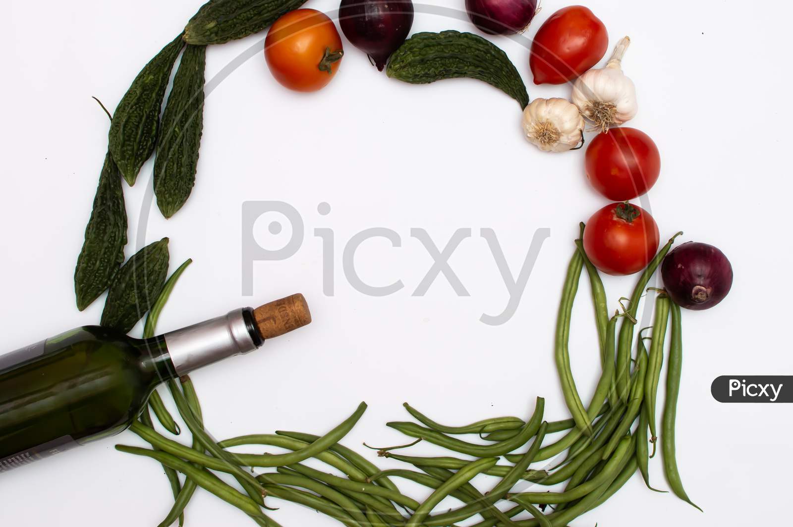 vegetables, fruits and wine placed on a white background