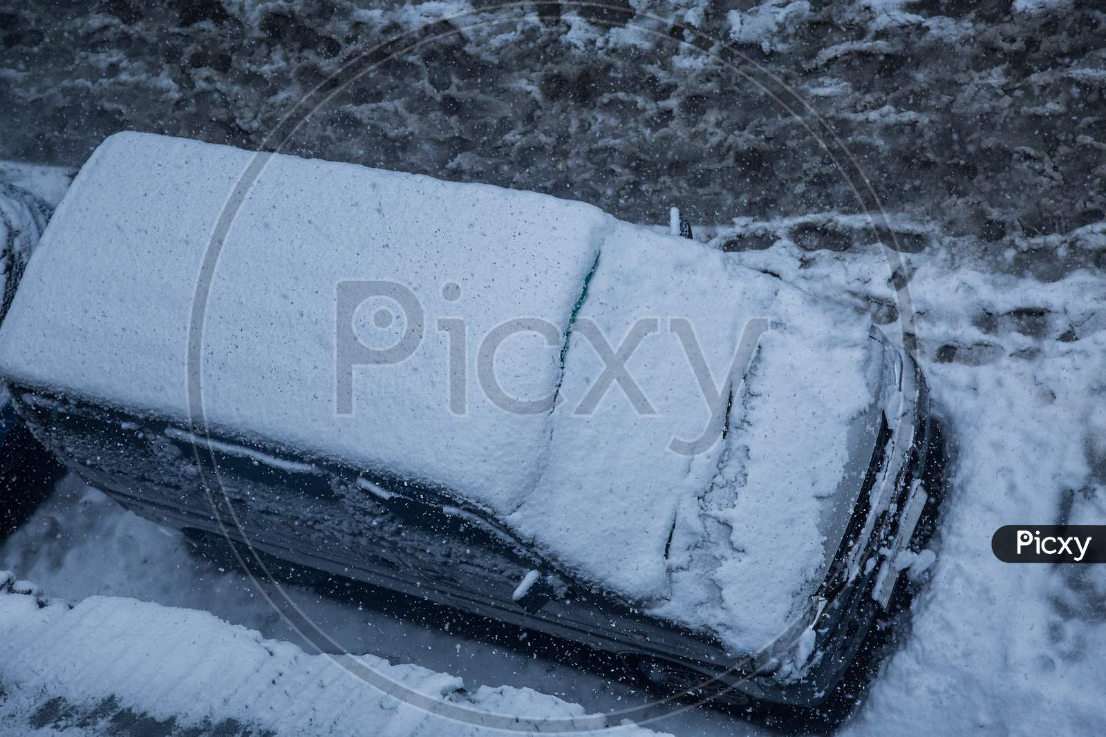 Car Covered With A Thick Layer Of Snow,Top Angle. Concept: Winter Weather And Car Owner Confrontation - Image