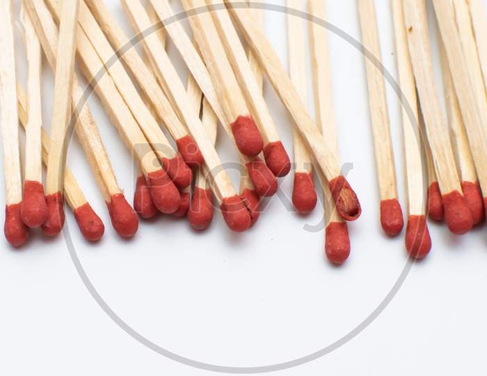 A bunch of match sticks on a white background