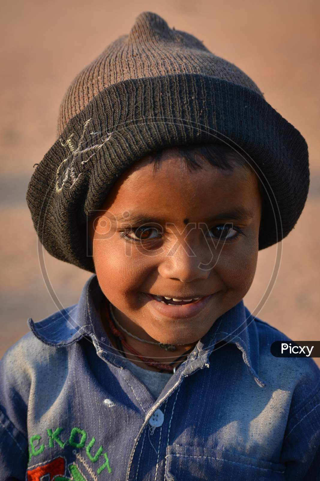 TIKAMGARH, MADHYA PRADESH, INDIA - FEBRUARY 11, 2020: Little kid smiling at the camera.