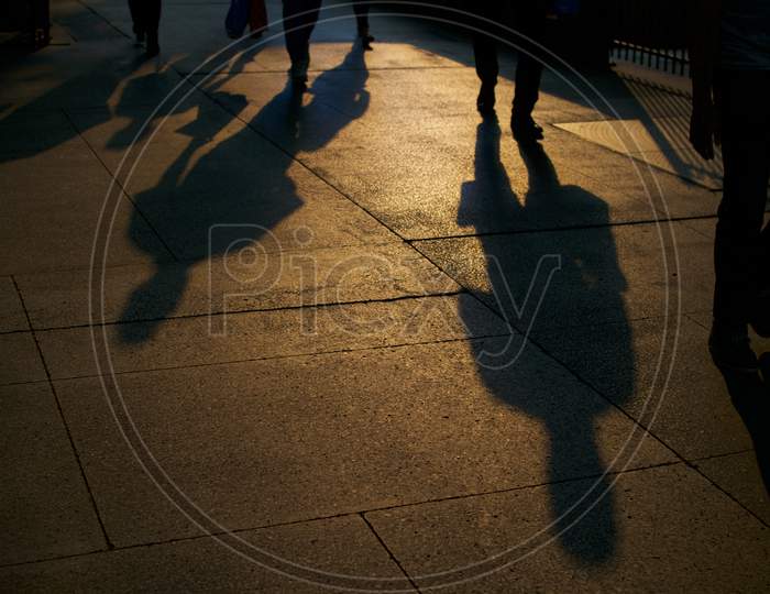 Shadows Of Walking People