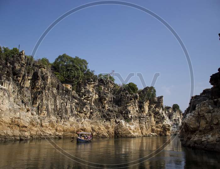 Jabalpur, Madhya Pradesh/India : January 28, 2020 - Tourists Riding In Small Wooden Boat On Narmada River At Bhedaghat, Jabalpur