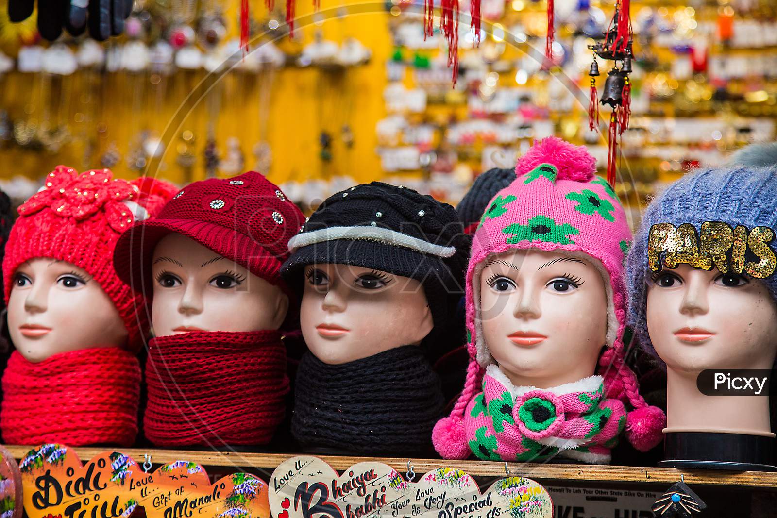 Faces Of Female Mannequins Wearing A Colorful Knitted Woolen Caps And Scarfs In Store, Winter Cloths Concept, Background - Image