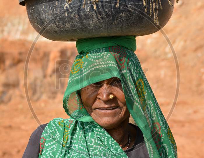 TIKAMGARH, MADHYA PRADESH, INDIA - FEBRUARY 09, 2020: A portrait of old unidentified indian woman at her village, An Indian rural scene.