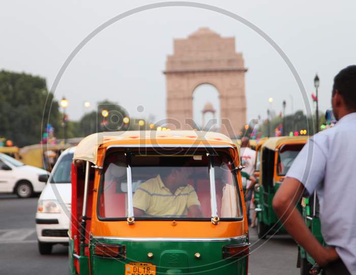 Selective Focus on an Auto with Indian Gate in the Background