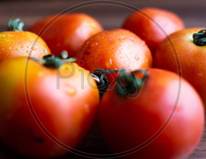 Tomatoes placed together and one is focused