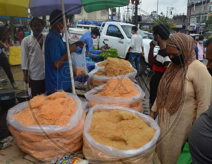 People Wearing Face Mask And Buying Vermicelli From A Roadside Shop Ahead Of Eid-Ul-Fitr, During The Fourth Phase Of Ongoing Covid-19 Nationwide Lockdown, In Guwahati On Saturday, May 23, 2020.