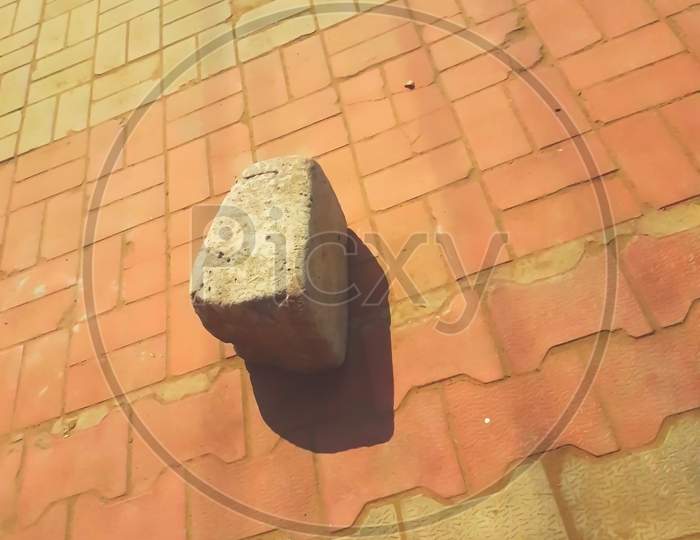Big Stone With Its Shadow Lying On The Ground