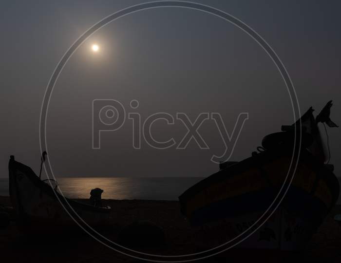 Moon Light At Seashore With Fisherman Boat Shadow