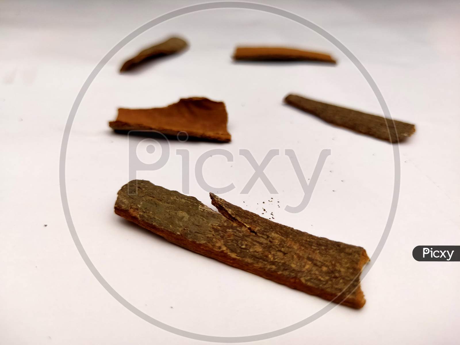 Cinnamon stick barks isolated in white background.