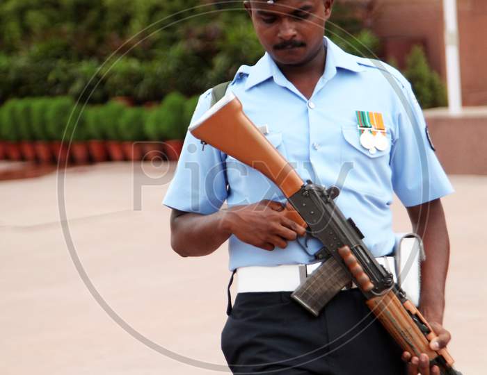 A Security Officer with Gun near India Gate