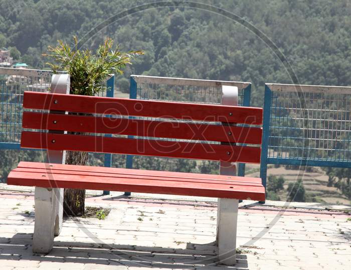 A Concrete resting Bench in a Railway Station