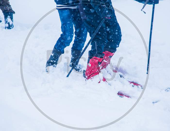 Guys Learning Skiing On A Snowy Day, Skiing Equipment Isolated On Pure White Background, Adventurous Activity - Image