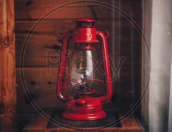 Old fashioned red colored lantern / oil lamp