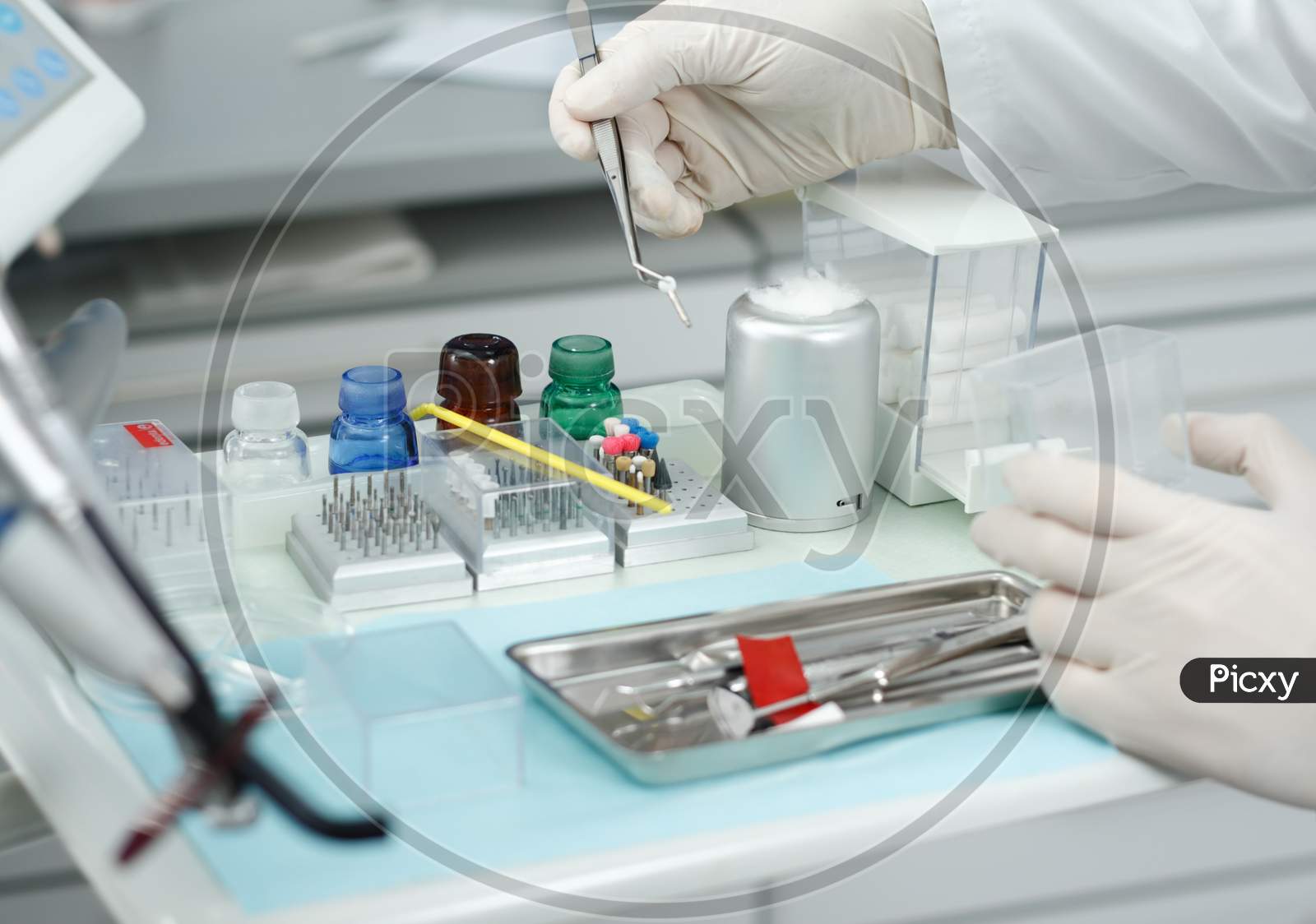 A technician / doctor holds instrument in hands for further activity in laboratory