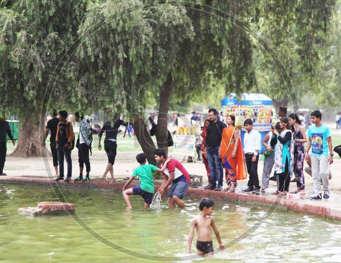People swimming in a water Pond