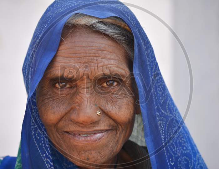 TIKAMGARH, MADHYA PRADESH, INDIA - FEBRUARY 08, 2020: Closeup portrait of an old indian woman at her village.