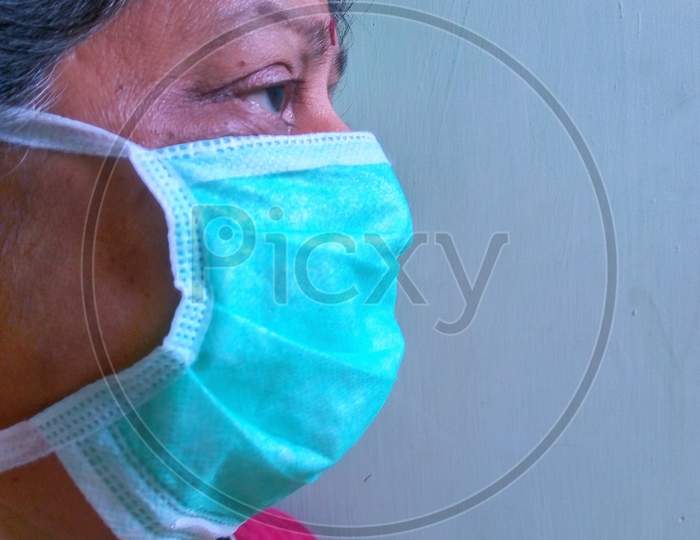 Woman wearing mask Corona mask colour
