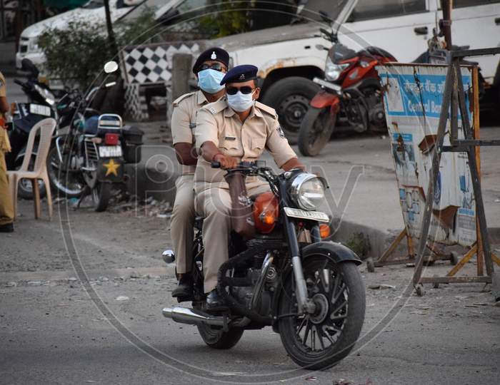 COVID 19 Corona Virus lockdown in India. Police on duty to stop people from roaming in the city and make them follow lockdown to prevent the spread of Corona. Protection from COVID 19. Corona warriors.