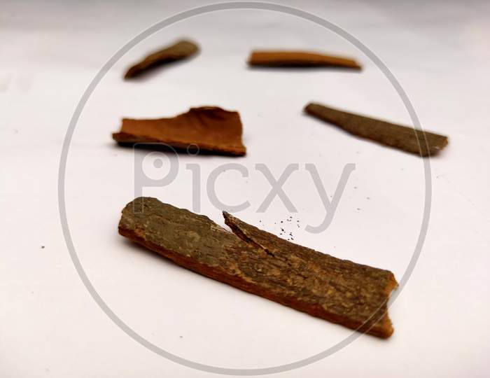 Cinnamon stick barks isolated in white background.