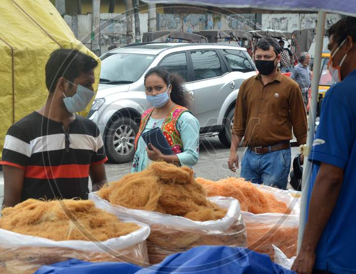 People Wearing Face Mask And Buy Vermicelli From A Roadside Shop Ahead Of Eid-Ul-Fitr, During The Fourth Phase Of Ongoing Covid-19 Nationwide Lockdown, In Guwahati On Saturday, May 23, 2020.