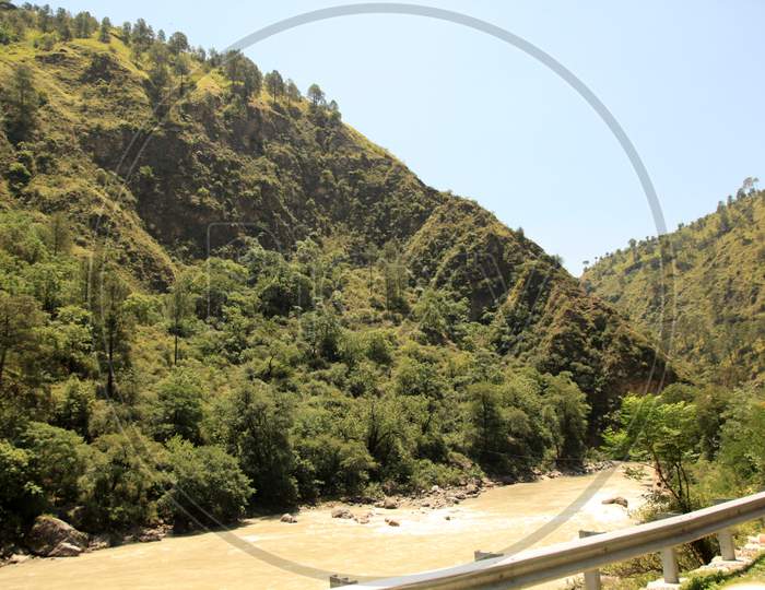 Beautiful Mountains of Himachal Pradesh with water flow in the foreground